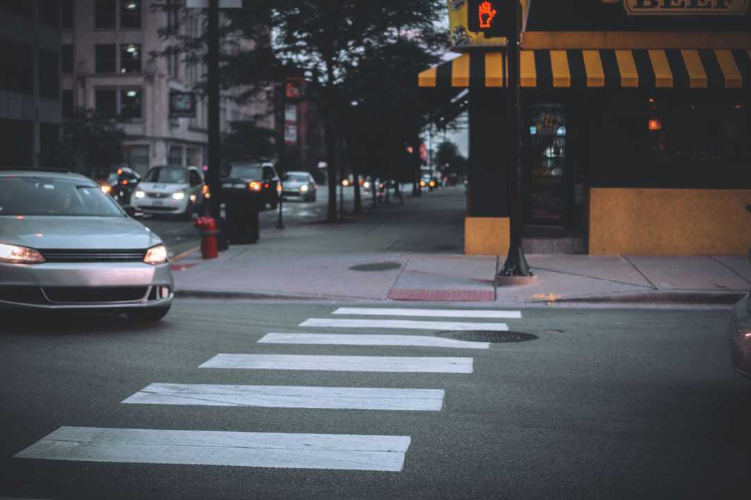 Figure 1: Car about to stop at pedestrian crossing.Photo by Wesley Armstrong on Unsplash