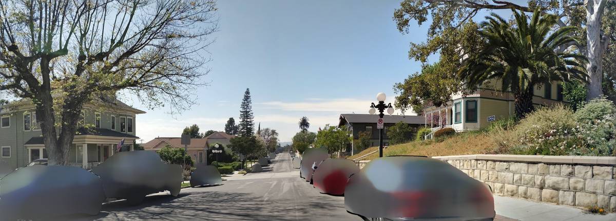 Blurred vehicles on a suburban street in the USA